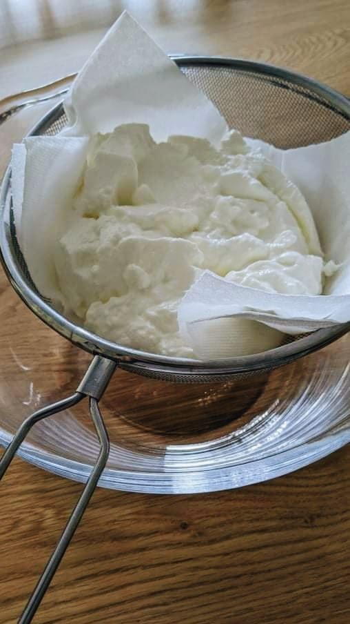 straining the yogurt for the thickest tzatziki sauce