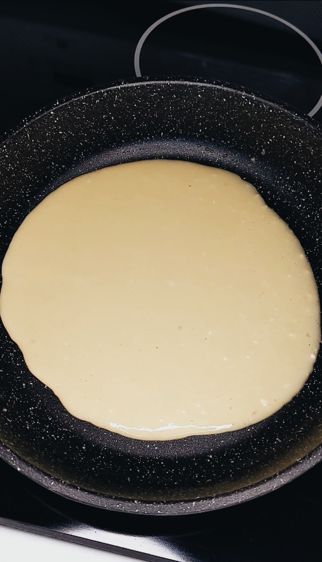 right after pouring the batter for the French stuffed crêpes. the batter will be spread across the pan to thin it out. 